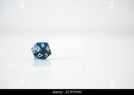 A nat 20 is rolled on a 20 sided dice used for agmes of Dungeons & Dragons, a popular tabletop roleplaying game. Stock Photo