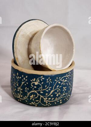 Hand made traditional ceramic butter bell pottery with blue finish and leaf  pattern Stock Photo - Alamy