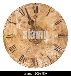 Vintage and heavily weathered clock face with time set to a few minutes to twelve o clock isolated on a white background Stock Photo