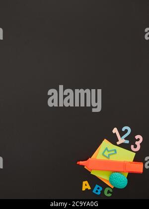 School supplies on chalkboard Stock Photo
