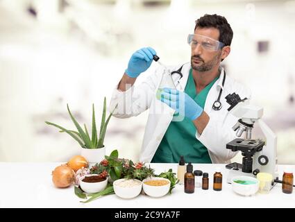 Young male scientist doing experimentation in the laboratory Stock Photo