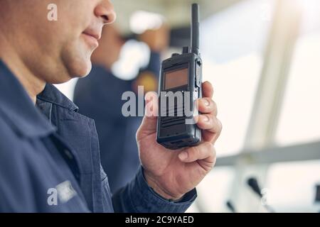 Portrait of handsome man with radio near the face Stock Photo