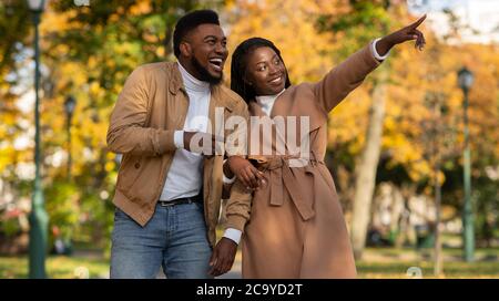 Loving african american couple dating in park, enjoying autumn day outdoors Stock Photo