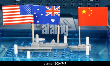 American US and Royal Australian Naval navy ships meet head on Chinese navy warship in disputed south china spratly island international waters Stock Photo