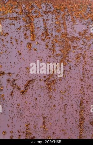 Old sheet metal from rust. Corroded metal background. Vertical frame. Stock Photo