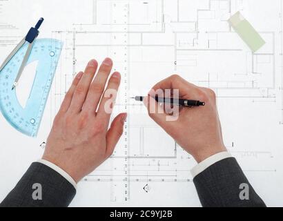 Architect working on blueprints Stock Photo