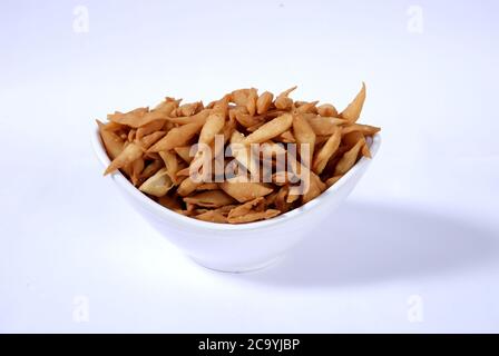 Shakkar pare Also Know as Shakkarpare, Shakarpare, Shakarpali, Shakkar Para, Sakarpara or Shankarpalli or shankar pale is a Snack Typically Stock Photo