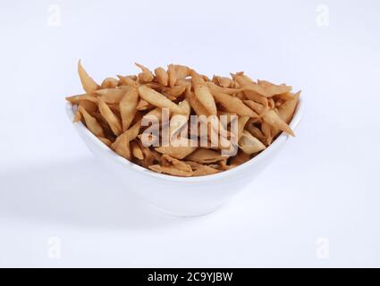 Shakkar pare Also Know as Shakkarpare, Shakarpare, Shakarpali, Shakkar Para, Sakarpara or Shankarpalli or shankar pale is a Snack Typically Stock Photo