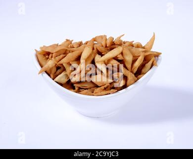 Shakkar pare Also Know as Shakkarpare, Shakarpare, Shakarpali, Shakkar Para, Sakarpara or Shankarpalli or shankar pale is a Snack Typically Stock Photo