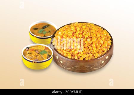 Fried and Spicy Chana Dal is a very popular Gujarati snack, white bowl on white background, pouch packing common street snack from India, selective Stock Photo