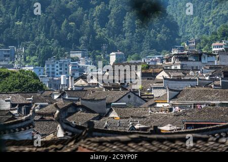 Feng Huang, China -  August 2019 : View of tiled rooftops of historic old buildings in Fenghuang Old Town, Hunan Province Stock Photo