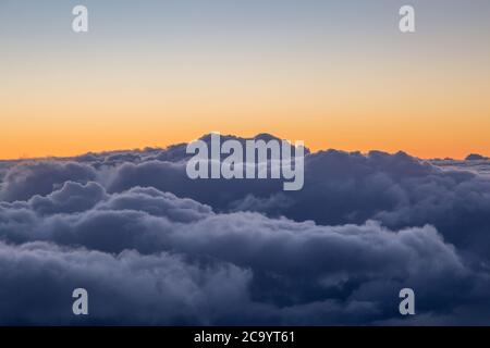 Dramatic Clouds and a Sunset Sky, Viewed from an Airplane Stock Photo