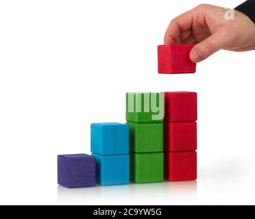 Wooden toy blocks on white background Stock Photo