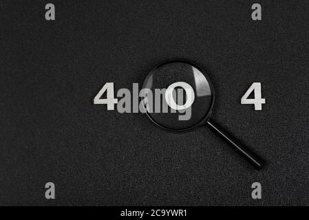 numerals 404 and magnifying glass on black background. Error concept. Stock Photo