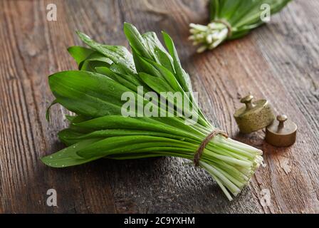 Wild garlic leafs on wood table Stock Photo