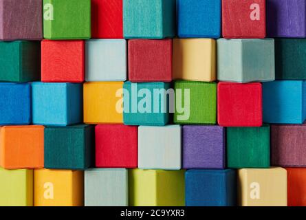 Multi-colored wooden toy blocks background Stock Photo