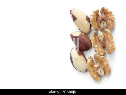 Three brazil nuts and walnuts on a white background Stock Photo