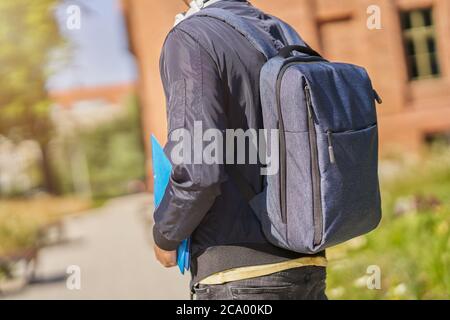 Back midsection of male student in the campus Stock Photo