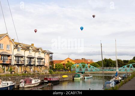 hot air balloons drift across Pooles Wharf marina, Hotwells, Bristol, England. July 2020 Stock Photo