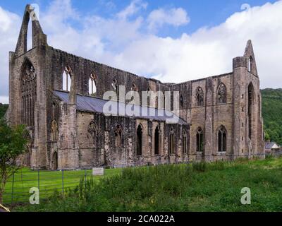 Ruins of Tintern Abbey founded 1131 by Walter de Clare Lord of Chepstow situated adjacent to village of Tintern in Monmouthshire on  Welsh bank of Riv Stock Photo