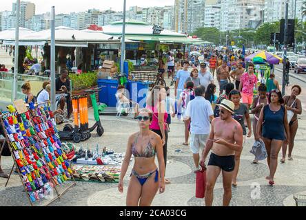 Rio de Janeiro, Brazil  January 28, 2019  Tourists at the Copacabana beach sidewalk Stock Photo