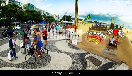 Rio de Janeiro, Brazil  January 28, 2019 Tourists on the Copacabana beach sidewalk Stock Photo