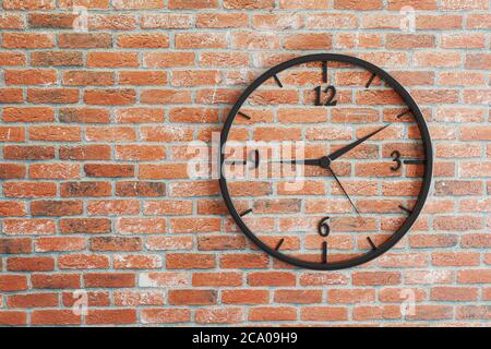 Isolated watch on rustic red brick wall background. Time measureing concept. High quality photo Stock Photo