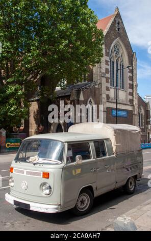 Converted, vintage Volkswagen camper van parked on a road in Camden ...