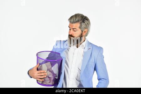 Destroy evidence. Insure important documents. Recover files after deletion. Businessman hold trash can. Man look for lost document in paper bin. Offic Stock Photo