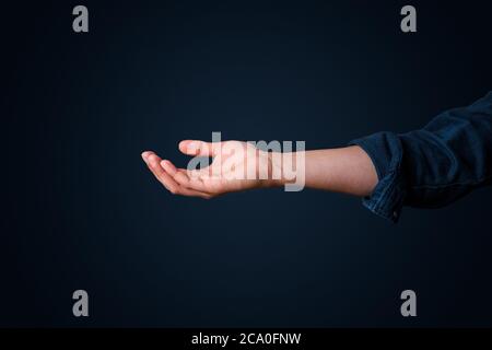 This male looking hand is holding something or is waiting to catch something from falling down Stock Photo