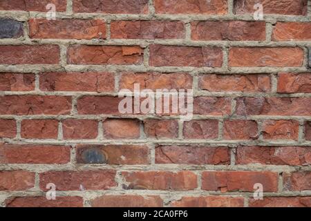 Real old brick wall crumbling from time to time Stock Photo