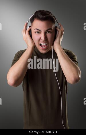 When the music is too loud he has to scream. This brunette Young