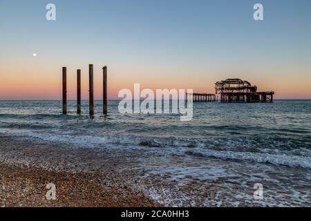 Brighton's West Pier silhouetted at sunset, on a summer's evening Stock Photo