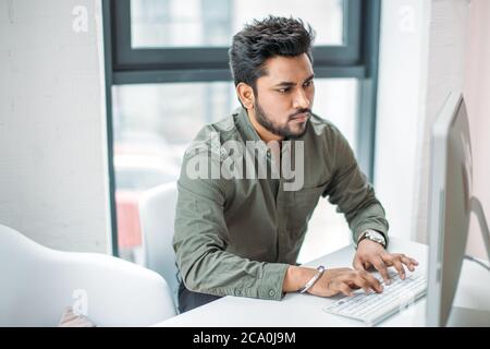 creative man with pc computer working at modern office Stock Photo