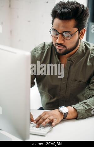 creative man with pc computer working at modern office Stock Photo