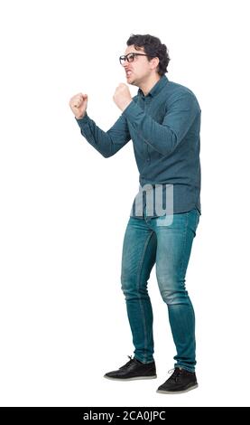 Side view full length hysterical and passionate businessman, keeps fists tight, shouting and screaming, isolated on white background. Business worker Stock Photo