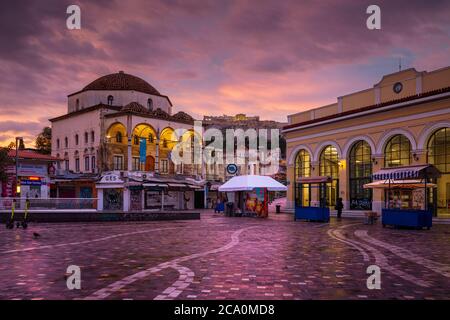 Athens, Greece - November 29, 2019: Early morning view of Acropolis, old mosque and metro station in Monastiraki square. Stock Photo