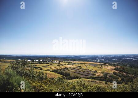 overhead view of landscape of sown fields against blue sky Stock Photo