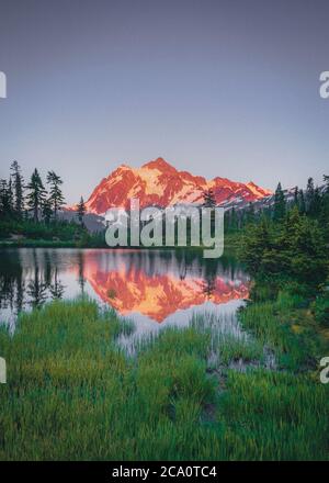 Picture lake on sunset with a reflection of mt. Shuksan, Washington Stock Photo