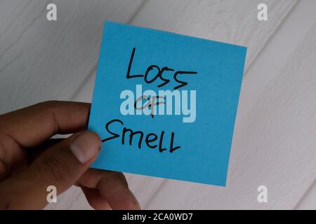 Loss of Smell write on sticky notes isolated on office desk. Stock Photo