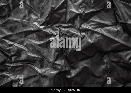 texture of crumpled black leather, black and white, background, close up Stock Photo