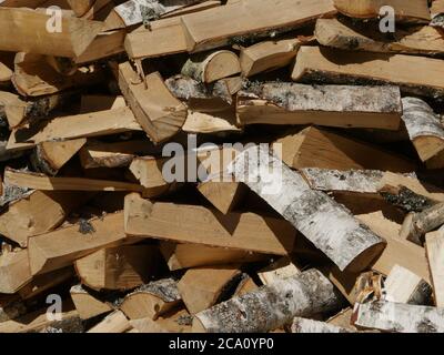 chopped birch firewood, heap, background Stock Photo