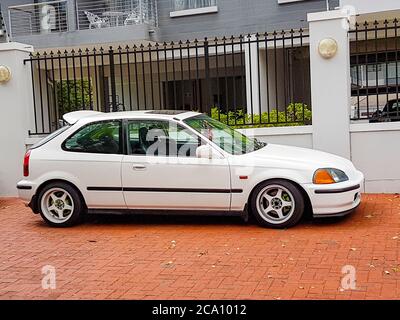 Small white car in Claremont Newlands, Cape Town, South Africa. Stock Photo