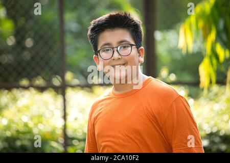 Happy boy at park looking at camera Stock Photo