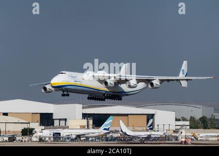 Tel Aviv, Israel. 3rd August, 2020. A Russian built Antonov AN-225 Mriya, carrying US military Oshkosh trucks to be fitted with Iron Dome missile defense systems, lands in Israel. The Israeli Ministry of Defense prepares to deliver to the US Department of Defense two Iron Dome batteries for short term needs for Indirect Fire Protection Capability for the United States Army to defend US troops against a range of ballistic and aerial threats. The AN-225 is the largest aircraft ever produced with over 30 wheels, six engines and a wingspan of 290ft. Credit: Nir Alon/Alamy Live News Stock Photo