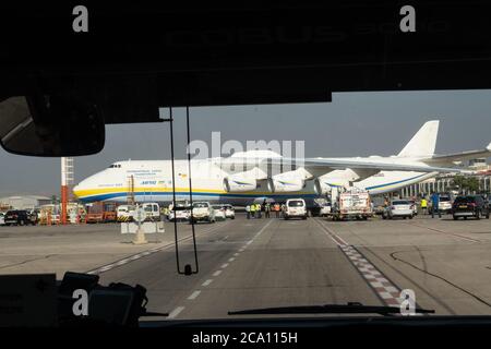 Tel Aviv, Israel. 3rd August, 2020. A Russian built Antonov AN-225 Mriya, carrying US military Oshkosh trucks to be fitted with Iron Dome missile defense systems, lands in Israel. The Israeli Ministry of Defense prepares to deliver to the US Department of Defense two Iron Dome batteries for short term needs for Indirect Fire Protection Capability for the United States Army to defend US troops against a range of ballistic and aerial threats. The AN-225 is the largest aircraft ever produced with over 30 wheels, six engines and a wingspan of 290ft. Credit: Nir Alon/Alamy Live News Stock Photo