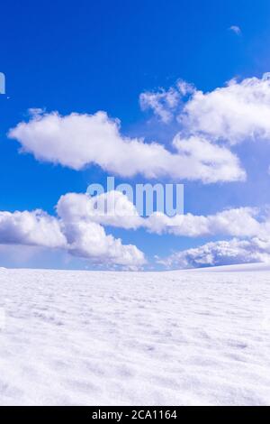 Great plain with snow on a sunny day with nice clouds. Stock Photo