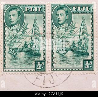 Fiji postage stamps issued in 1941 featuring an outrigger canoe Stock Photo