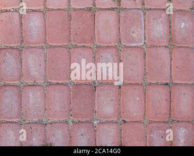 Close-up of sandy paving stones or blocks outdoors viewed from above. High resolution full frame textured background, top view. Stock Photo