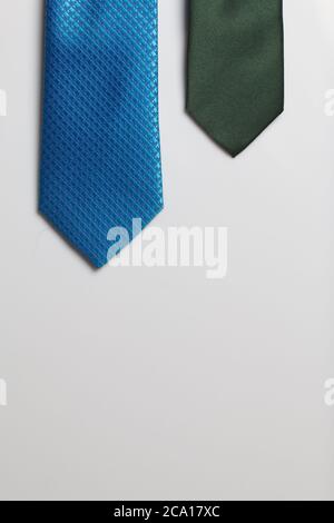 Two men's ties in different colors and sizes. For father and son. Love and Togetherness Objects. On a white background Stock Photo